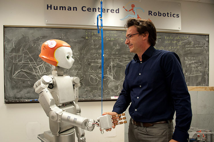 Robot shaking hand with human digital time clock
